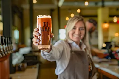 woman serving beet at Ogle Brewing