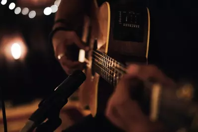 acoustic guitar being played